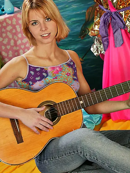 Playing the guitar before ditching it for some solo toying