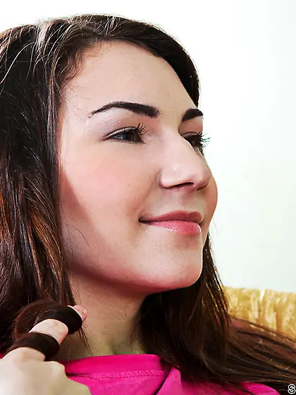 Adorable young lady fools around with her handsome boyfriend,  he